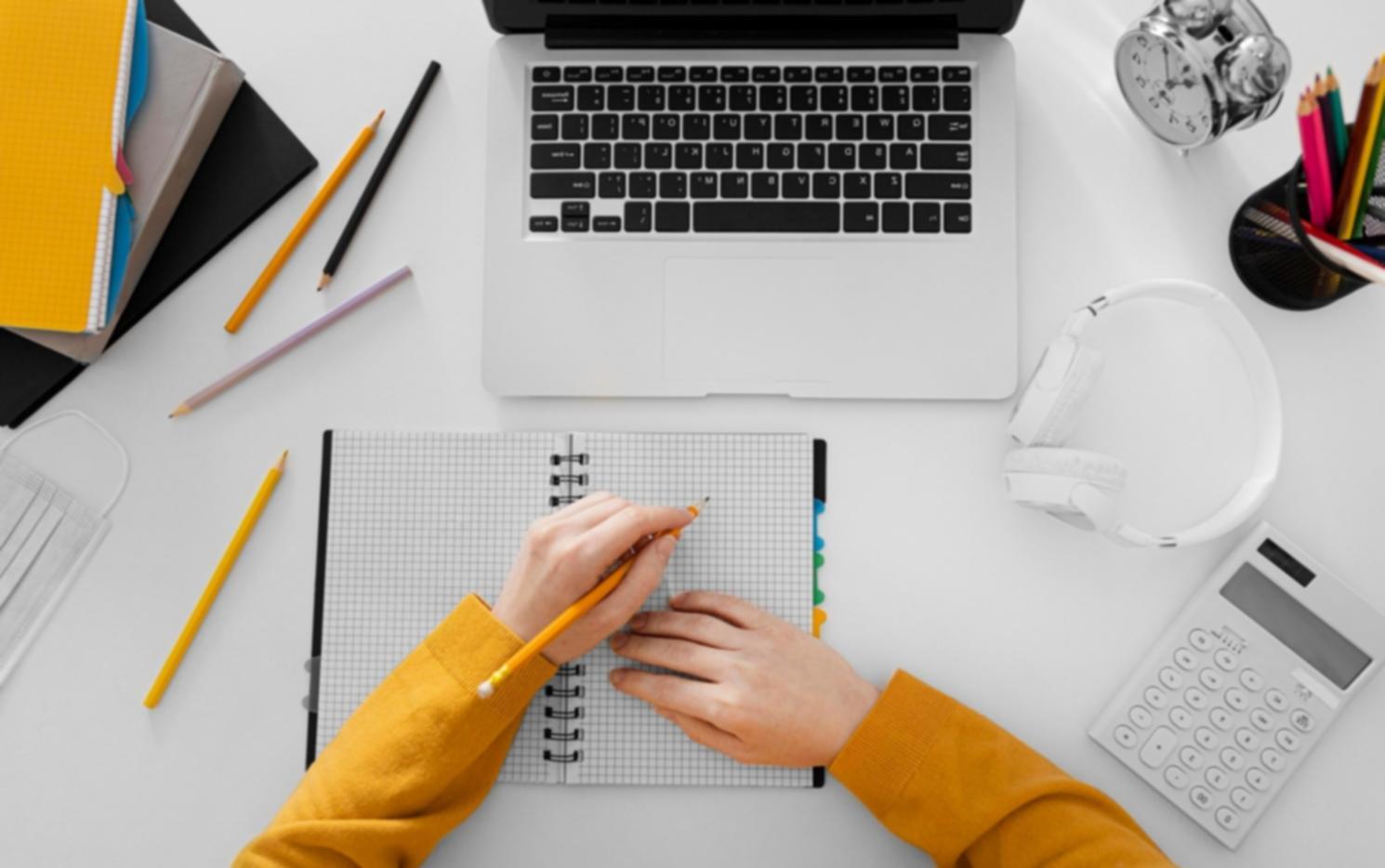 Person reviewing financial calculations and budget planning notes